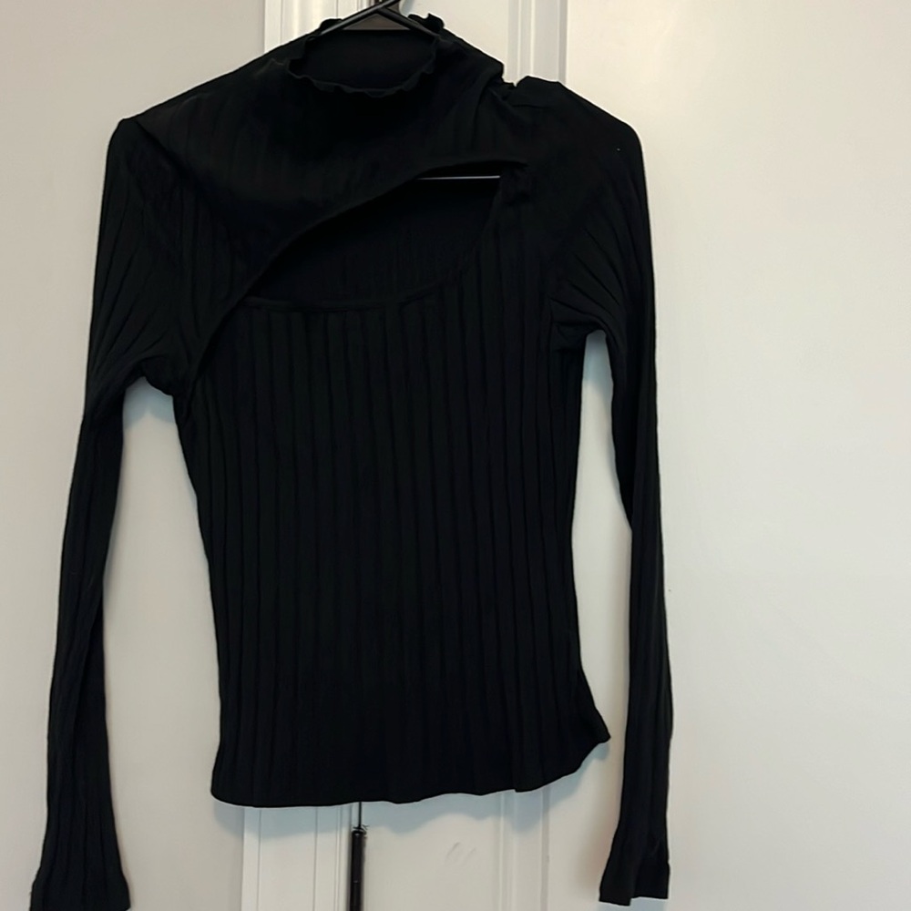 Pullover sweater with cleave area cutout